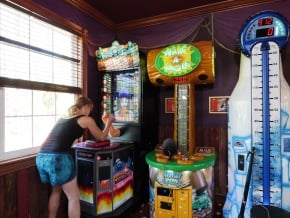 Carnival midway games like whack-a-mole and hammer strike at the Florida game house