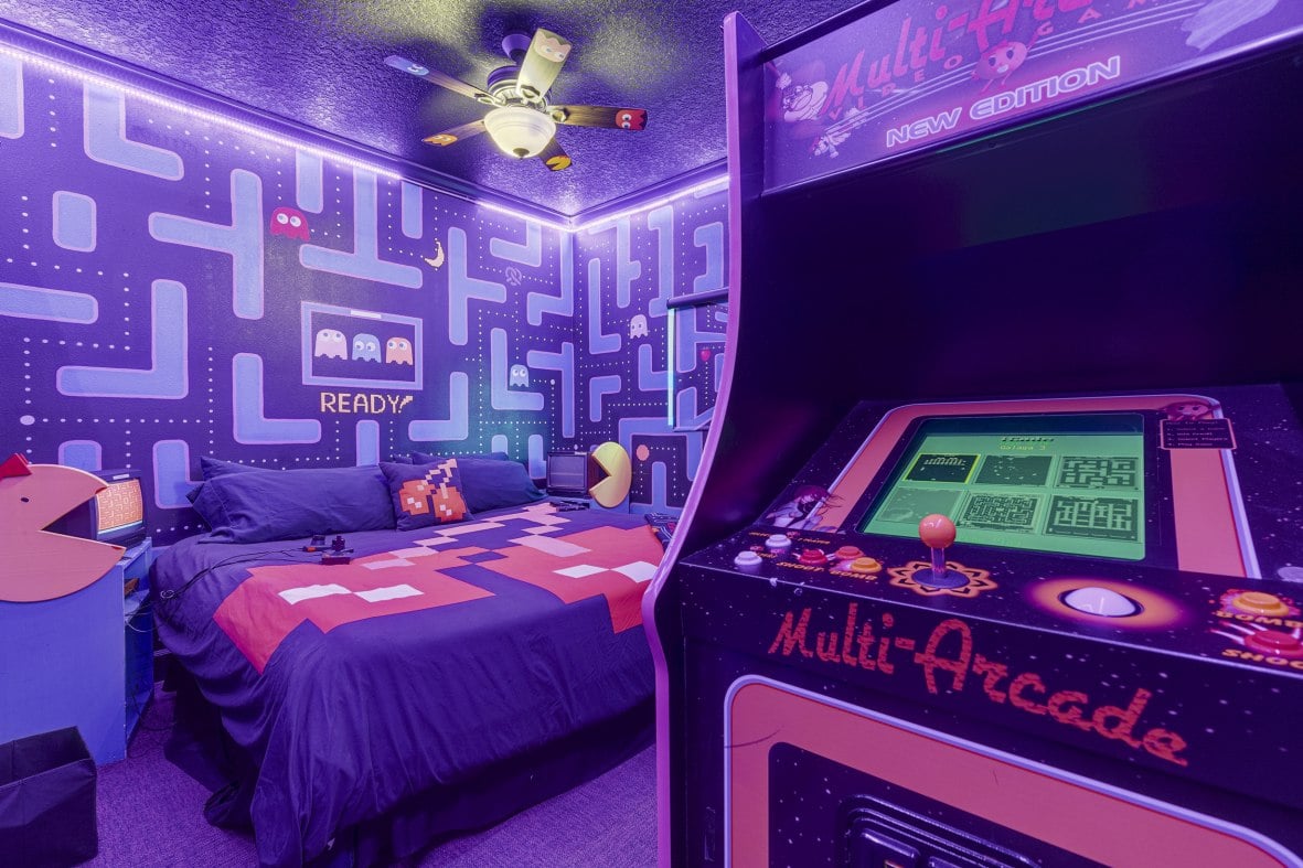 playing classic video games in a Ms. Pac-Man room at the arcade house airbnb vacation rental near Orlando, Florida